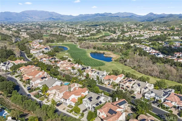 a view of a city with mountains in the background