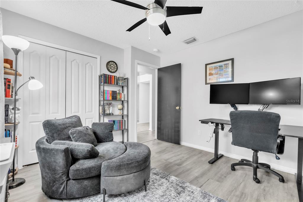 12410 Early Run Lane Riverview, FL 33578 - Photo 14 of 34 a living room with furniture and a flat screen tv
