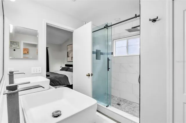 a bathroom with a sink and a mirror