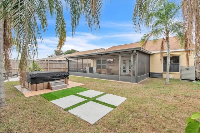 a view of a house with a backyard