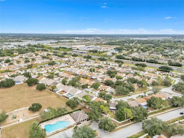an aerial view of residential building and ocean