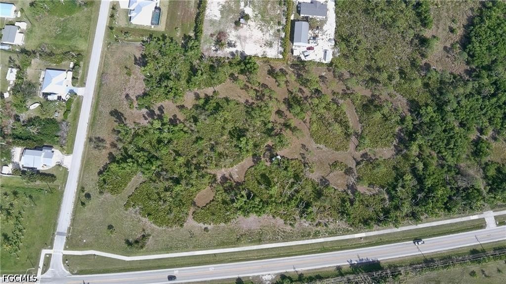 11900 Stringfellow Road Bokeelia, FL 33922 - Photo 5 of 8 a view of a yard from a balcony