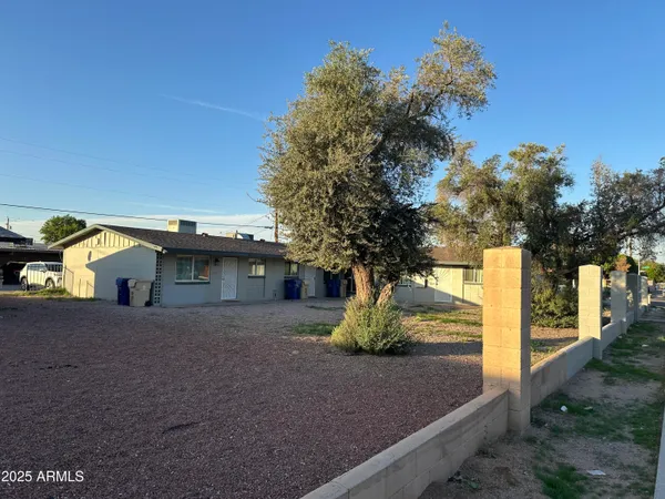 a view of a house with a tree