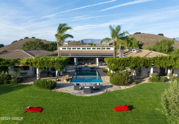 an aerial view of a house with garden