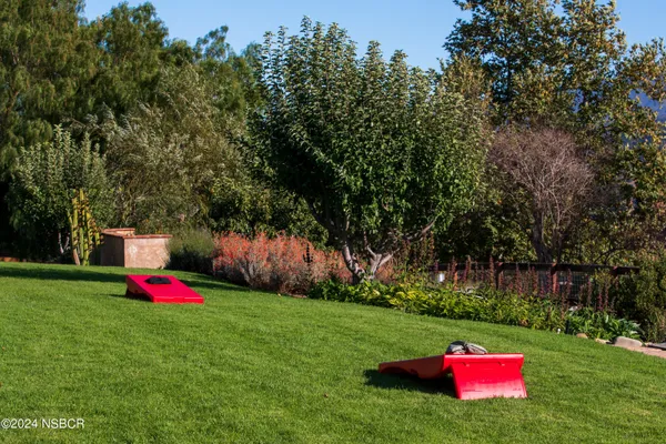 a outdoor living space with patio furniture and a fireplace