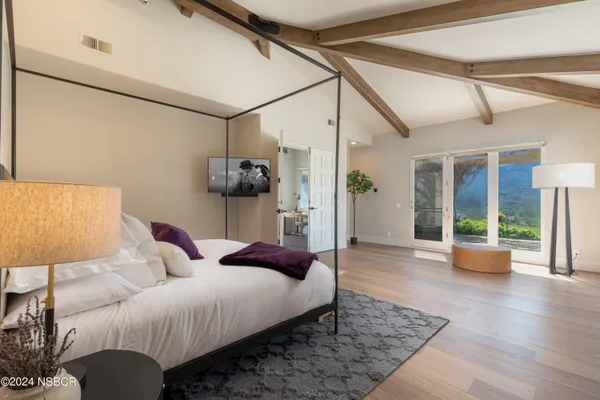 a bedroom with a bed and window