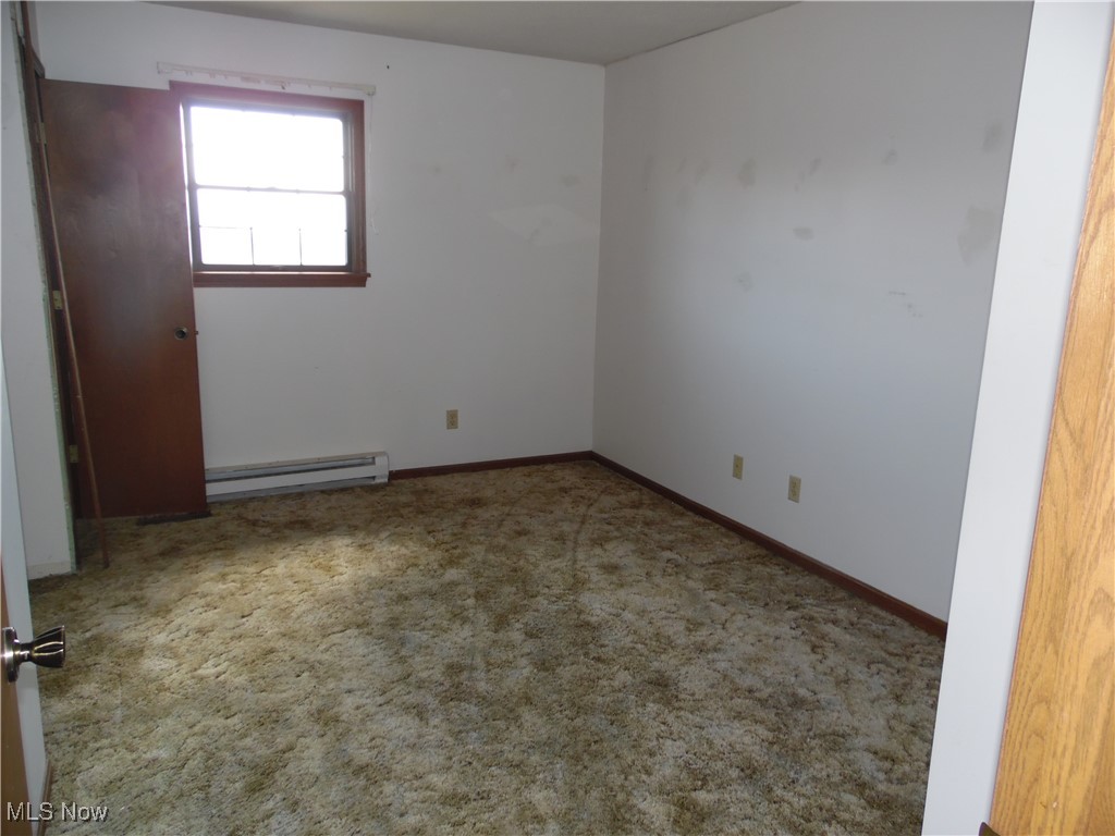 2800 Tick Ridge Road Lower Salem, OH 45745 - Photo 19 of 28 Carpeted spare room with baseboards and baseboard heating