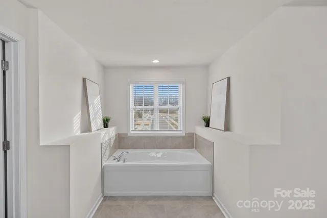 a bathroom with bathtub and a bathtub