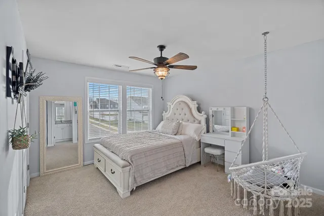 a bed room with a bed and a chandelier