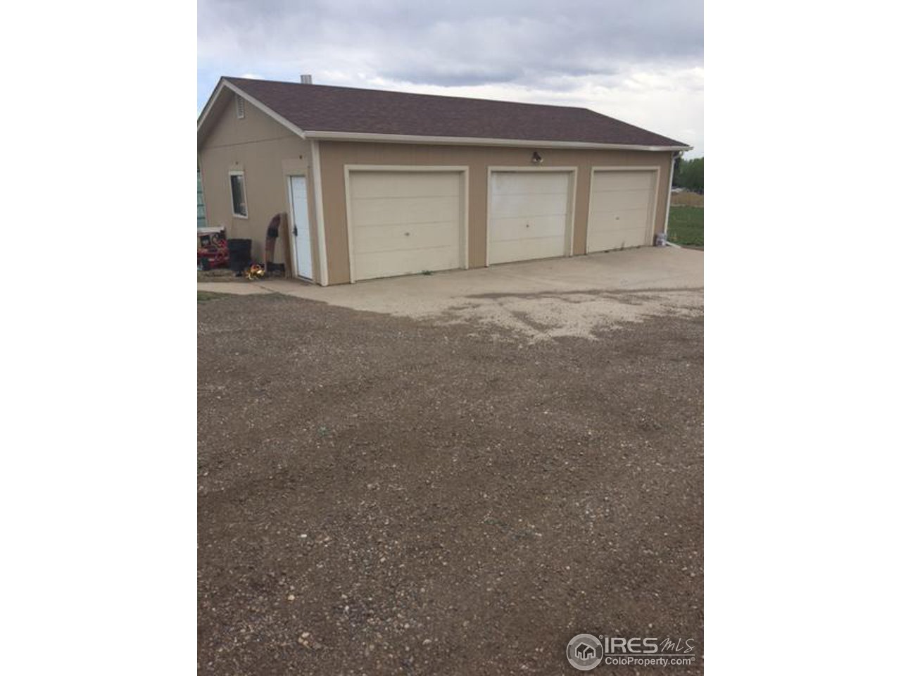 225 West Trilby Road Fort Collins, CO 80525 - Photo 2 of 2 a view of a house with a yard and garage