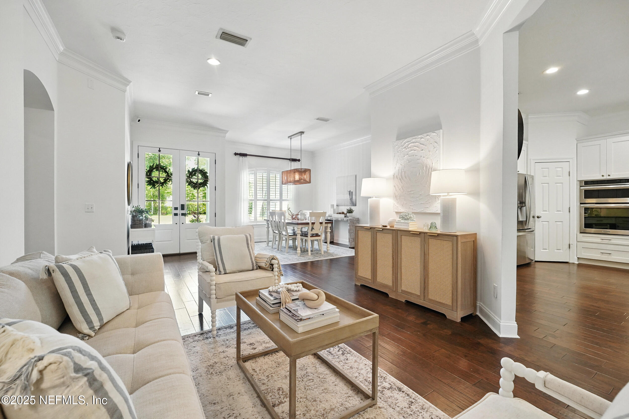 150 South Roscoe Boulevard Ponte Vedra Beach, FL 32082 - Photo 11 of 84 a living room with furniture a wooden floor and next to a window