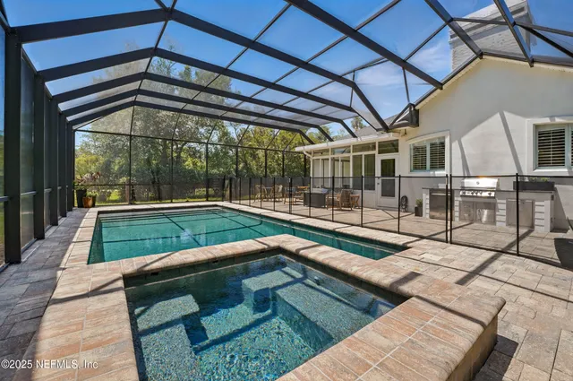 a view of swimming pool with a backyard
