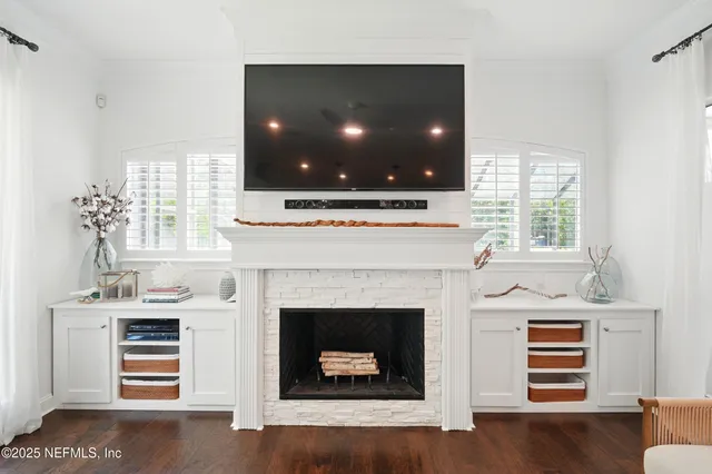 a bathroom with a granite countertop sink a toilet and a mirror