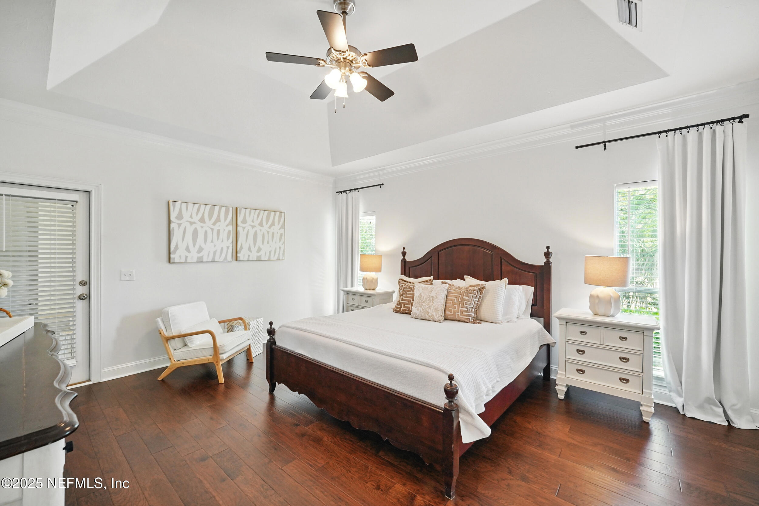 150 South Roscoe Boulevard Ponte Vedra Beach, FL 32082 - Photo 28 of 84 a bedroom with a bed and a chandelier
