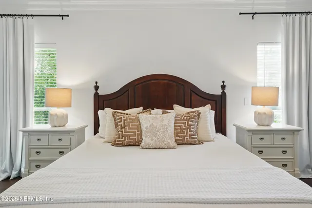 a bedroom with a bed and a chair