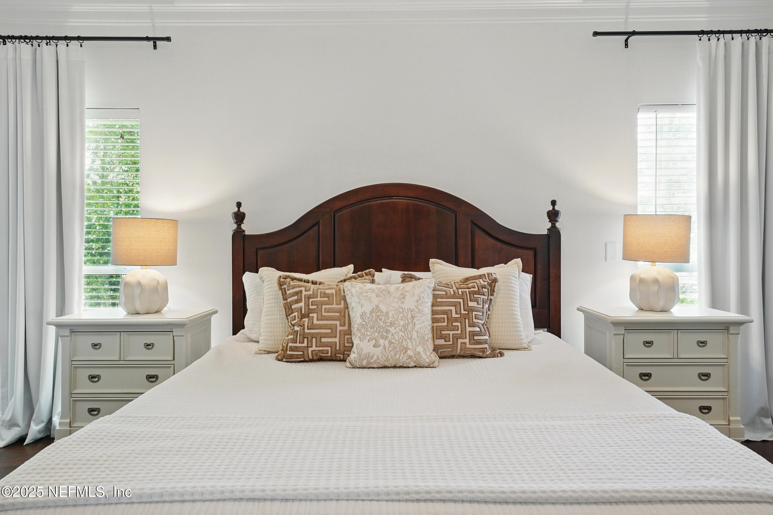 150 South Roscoe Boulevard Ponte Vedra Beach, FL 32082 - Photo 29 of 84 a large bed sitting in a bedroom next to a window and dresser