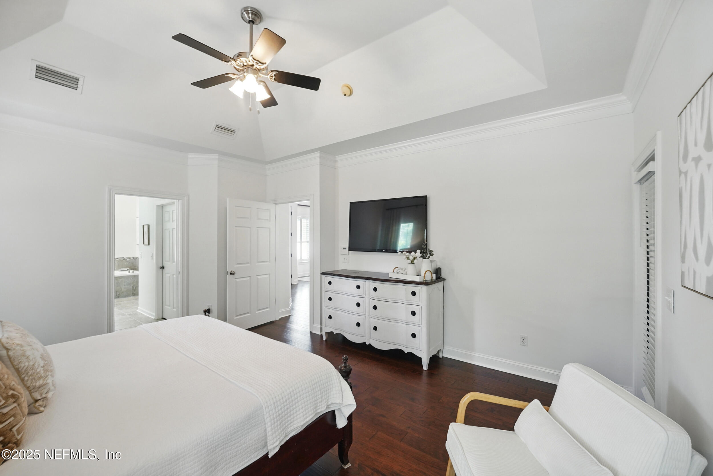 150 South Roscoe Boulevard Ponte Vedra Beach, FL 32082 - Photo 30 of 84 a bedroom with a bed and a flat screen tv