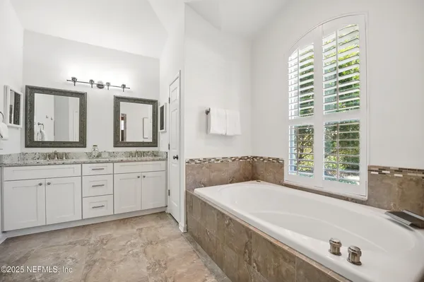 a bathroom with sink and mirror