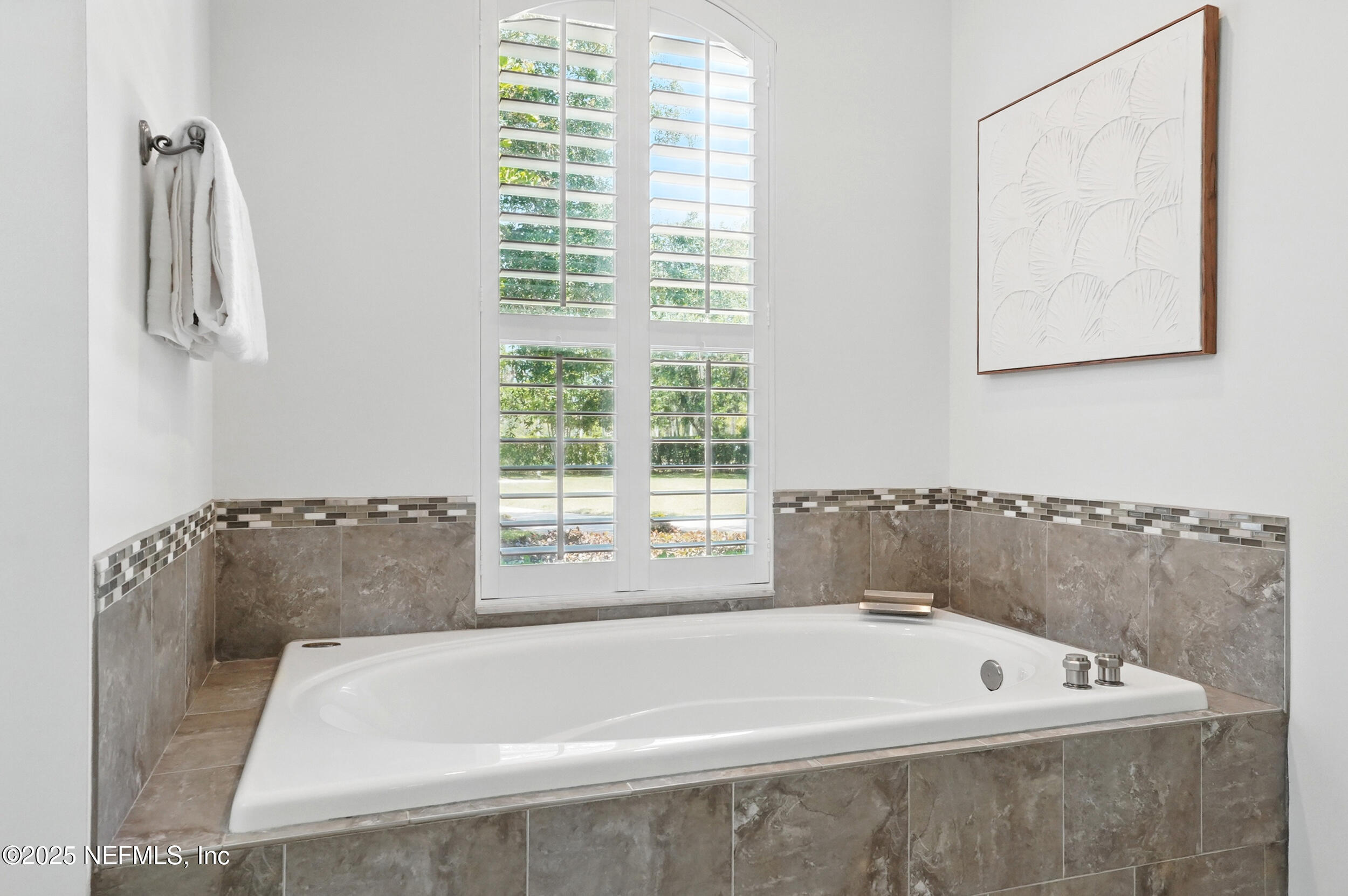 150 South Roscoe Boulevard Ponte Vedra Beach, FL 32082 - Photo 33 of 84 a bath tub sitting next to a window