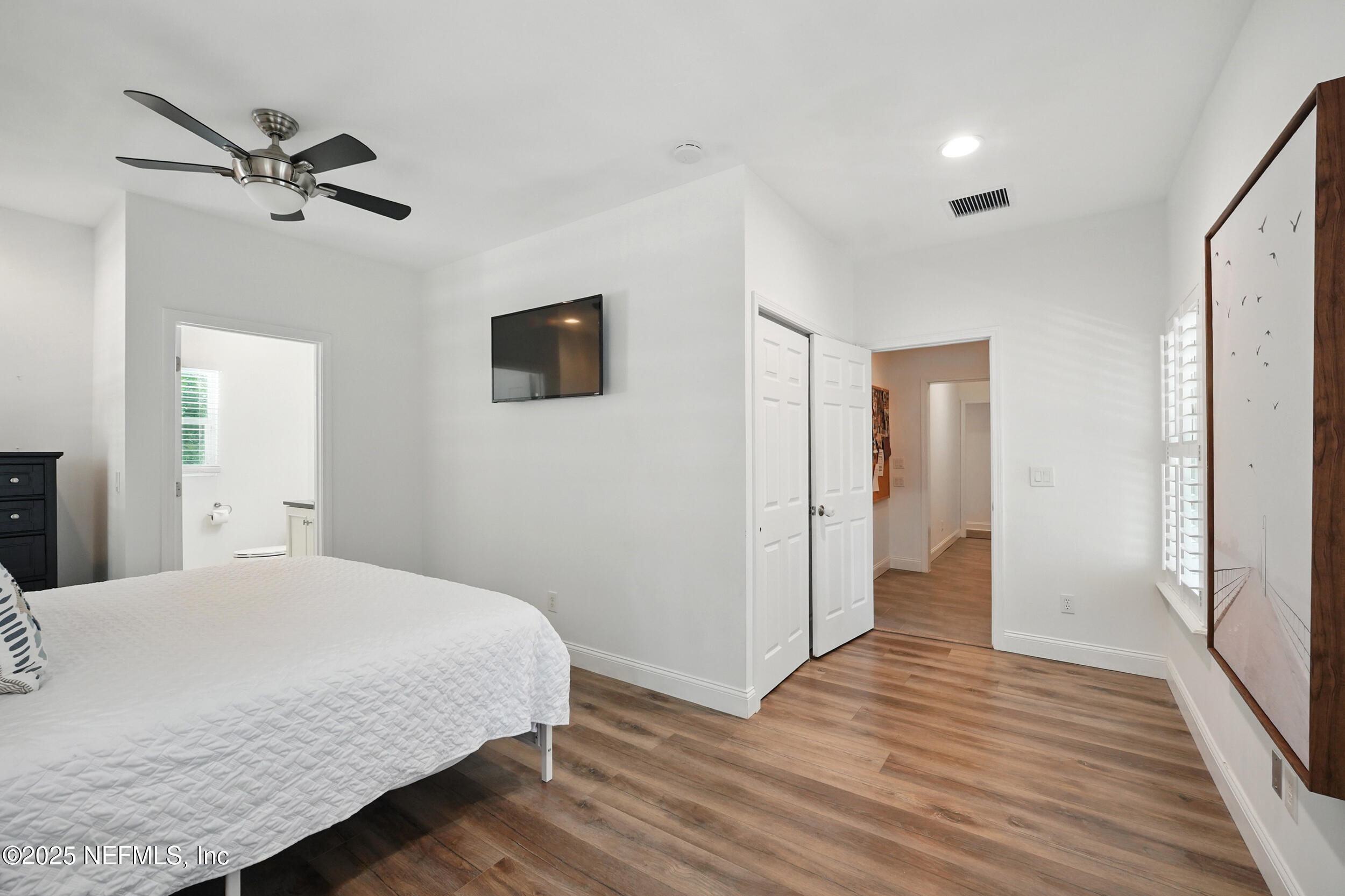 150 South Roscoe Boulevard Ponte Vedra Beach, FL 32082 - Photo 36 of 84 a bedroom with a bed and wooden floor