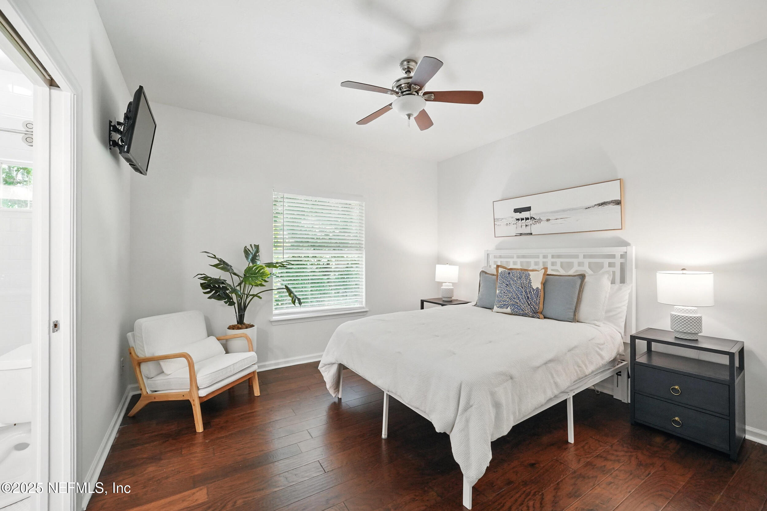 150 South Roscoe Boulevard Ponte Vedra Beach, FL 32082 - Photo 39 of 84 a bedroom with a bed and a chair