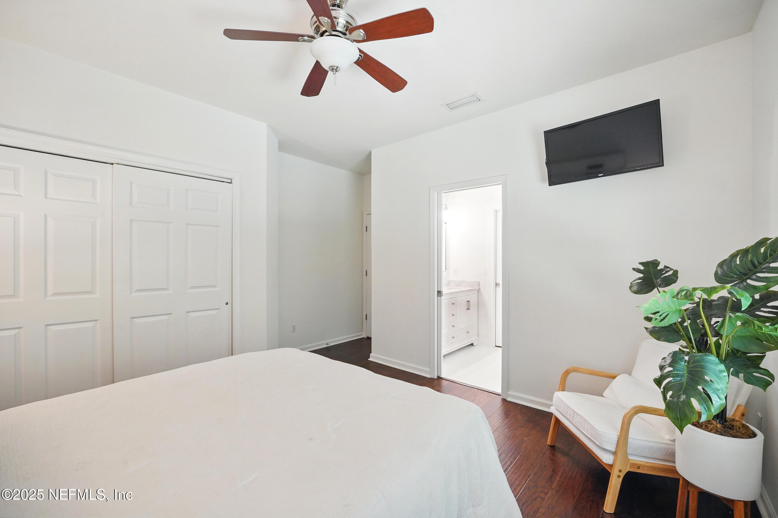 150 South Roscoe Boulevard Ponte Vedra Beach, FL 32082 - Photo 40 of 84 a bedroom with a bed and a chair