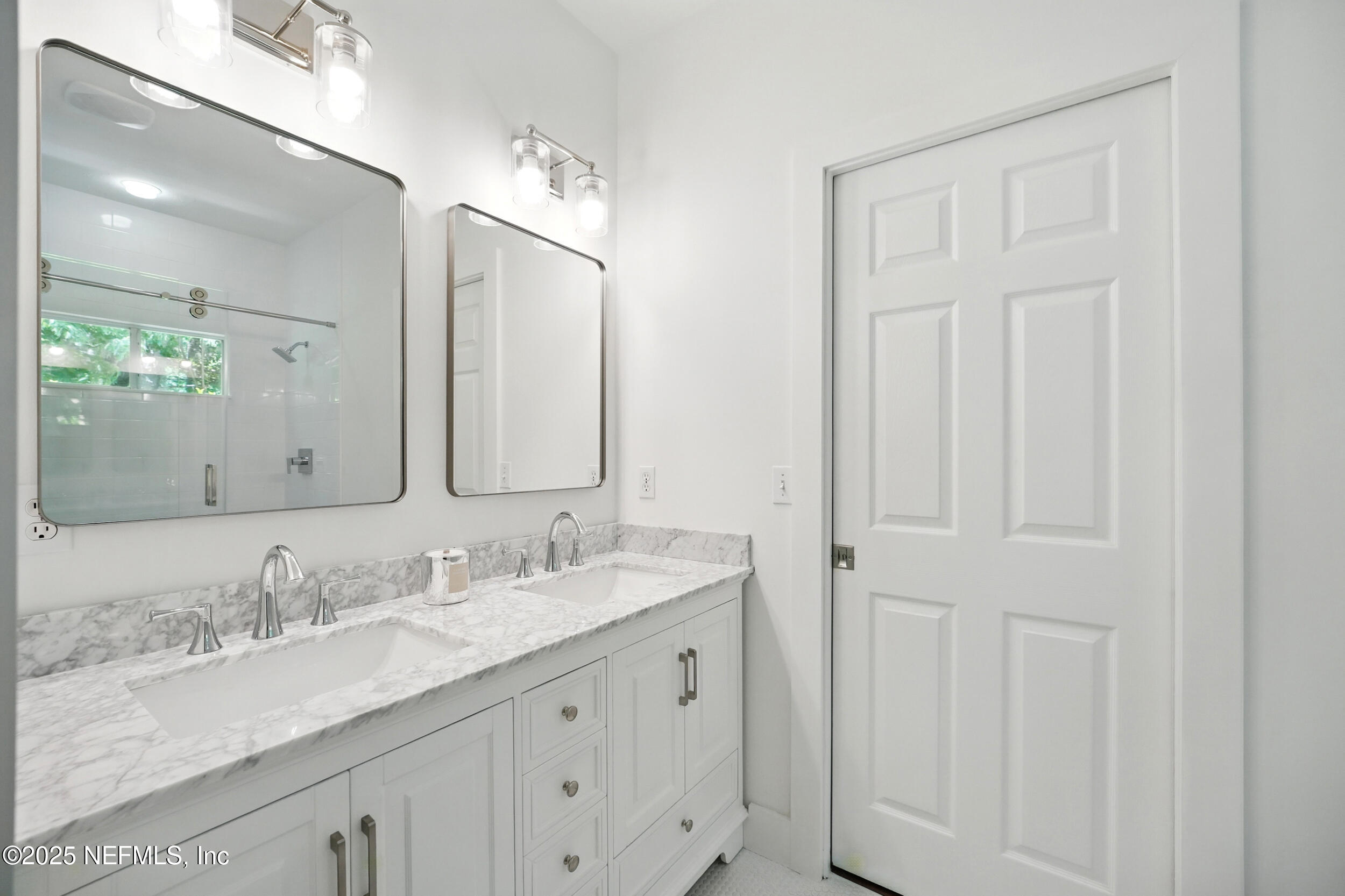 150 South Roscoe Boulevard Ponte Vedra Beach, FL 32082 - Photo 41 of 84 a bathroom with double sink and a mirror