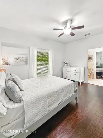 an aerial view of a house with swimming pool and garden