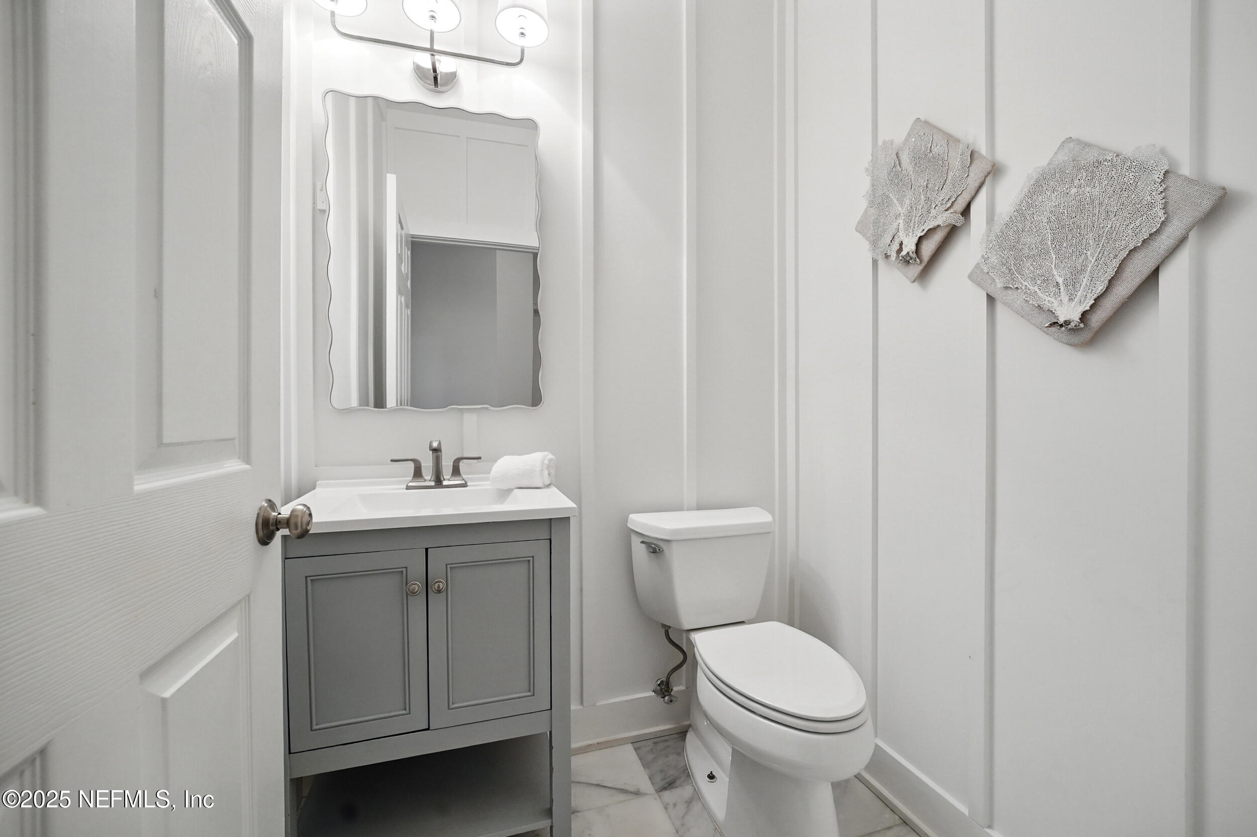 150 South Roscoe Boulevard Ponte Vedra Beach, FL 32082 - Photo 46 of 84 a bathroom with a toilet sink and mirror