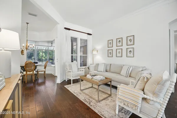 a living room with furniture and a table
