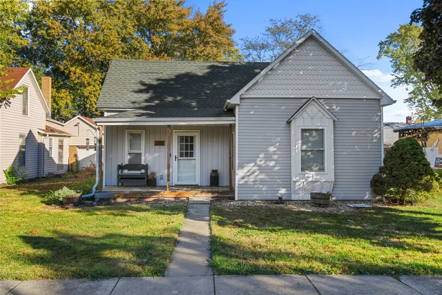 a view of house with swimming pool yard and outdoor seating