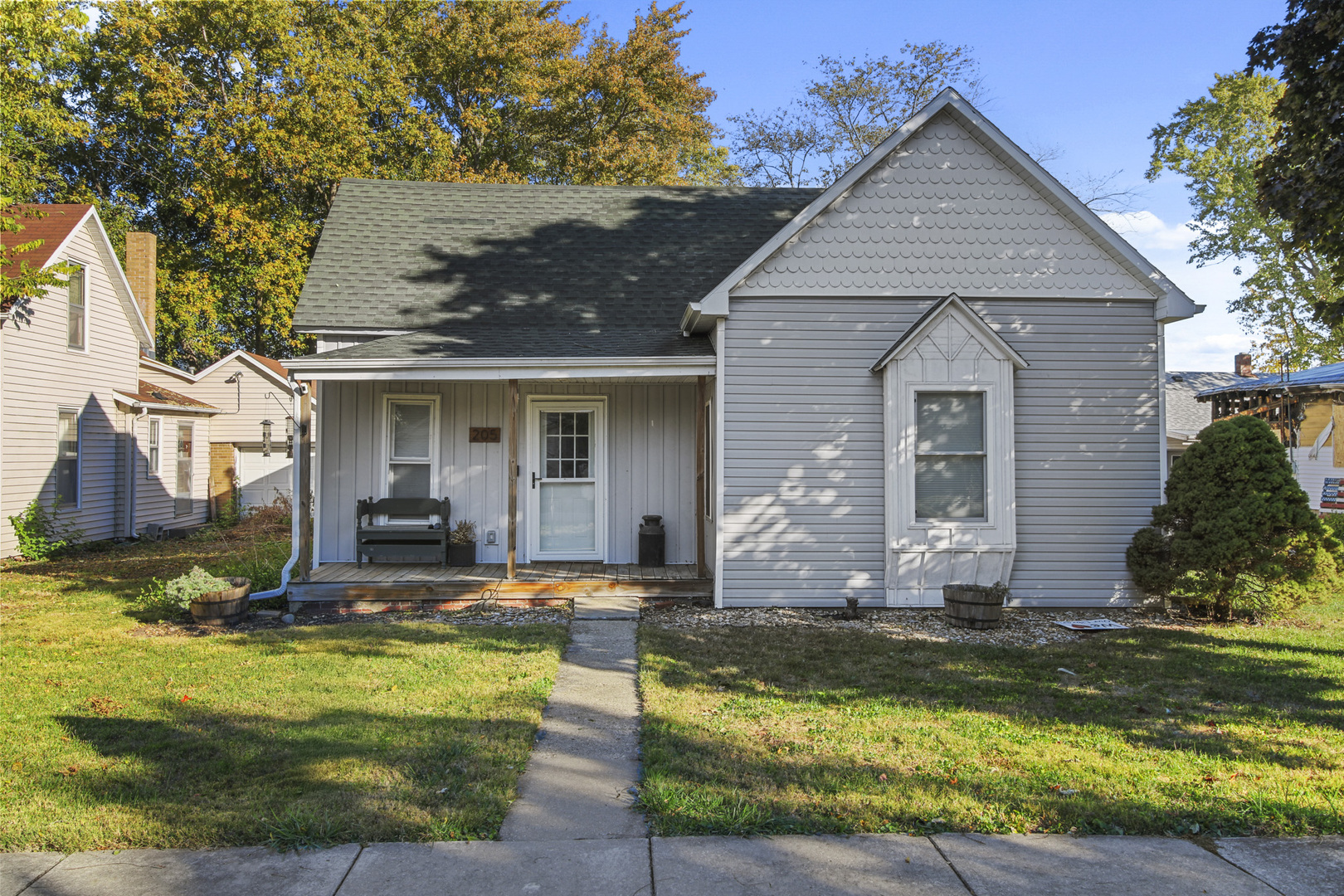 a view of house with swimming pool yard and outdoor seating