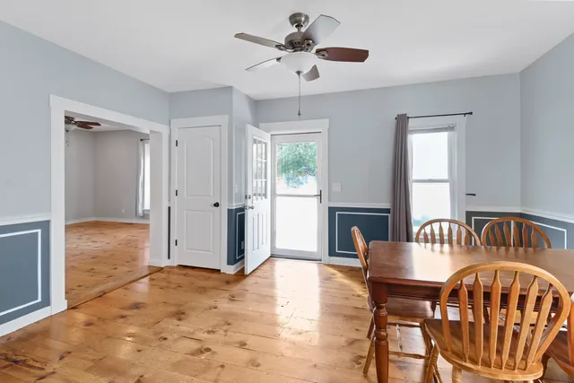 a view of a livingroom with furniture and a window