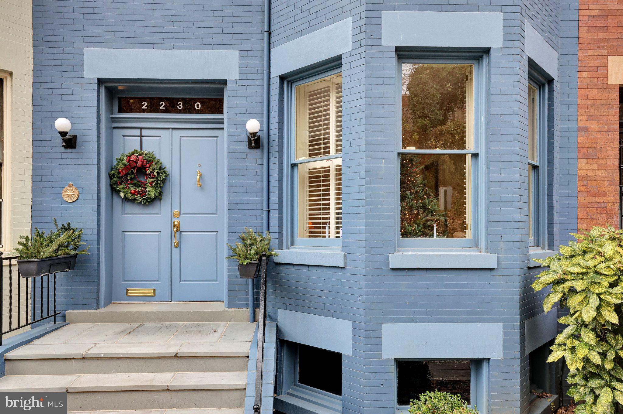 a front view of a house with garage