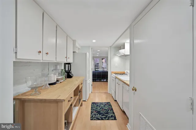 a kitchen with a sink and refrigerator