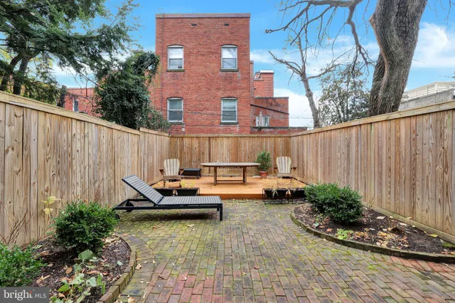 a backyard of a house with seating space