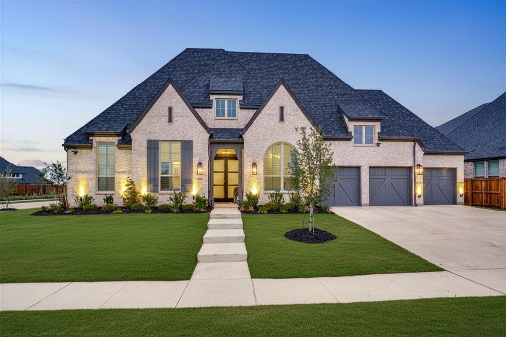 4400 Meander Way Prosper, TX 75078 - Photo 2 of 40 a front view of a house with a yard