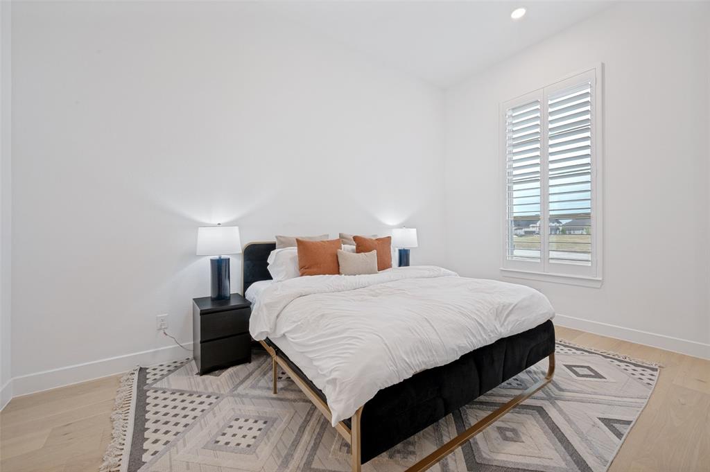 4400 Meander Way Prosper, TX 75078 - Photo 22 of 40 a bedroom with a bed and window