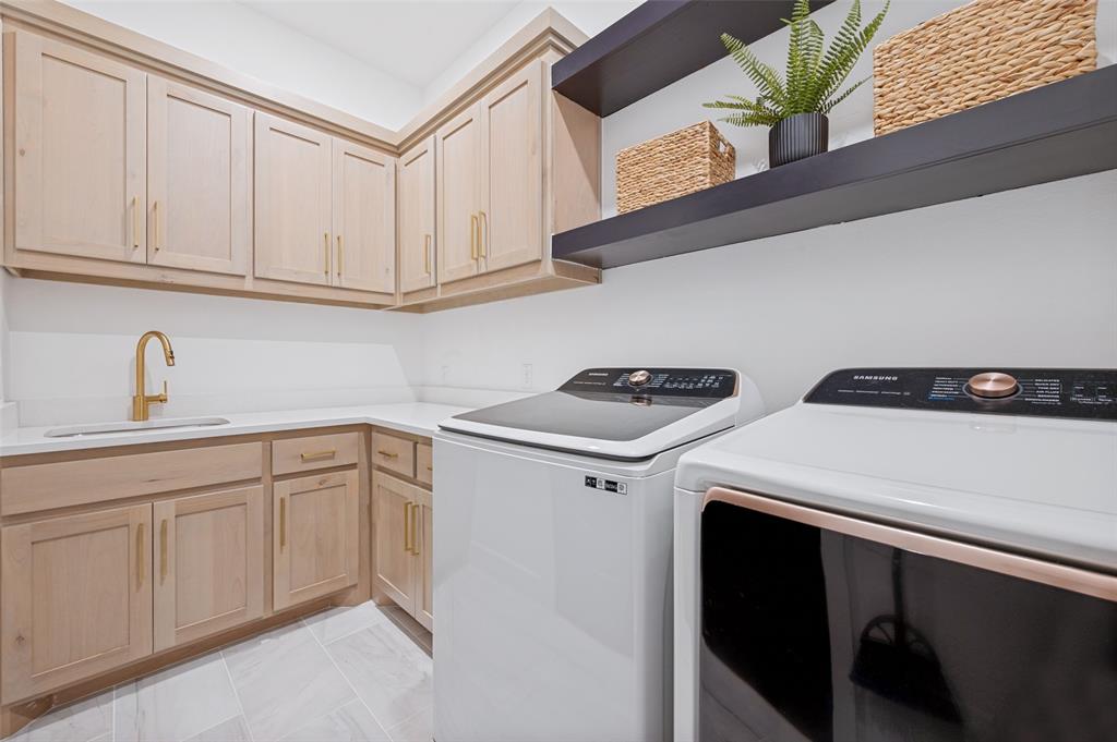 4400 Meander Way Prosper, TX 75078 - Photo 28 of 40 a kitchen with white cabinets a sink and dishwasher