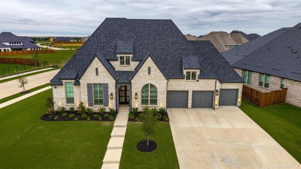 4400 Meander Way Prosper, TX 75078 - Photo 30 of 40 a front view of a house with a yard