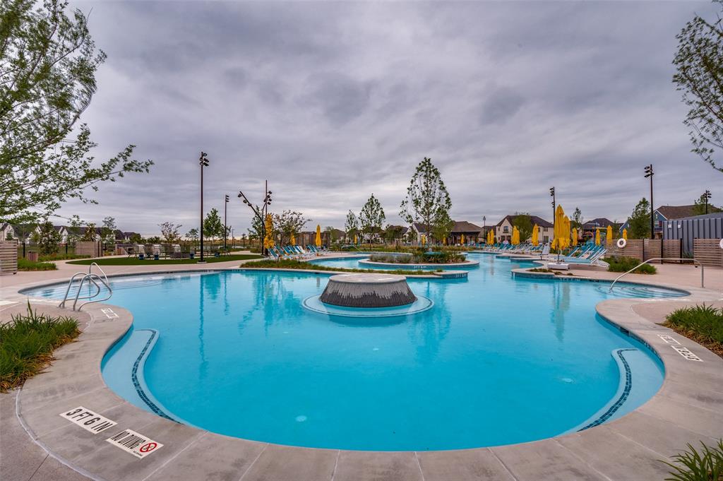 4400 Meander Way Prosper, TX 75078 - Photo 35 of 40 a view of a swimming pool with outdoor seating