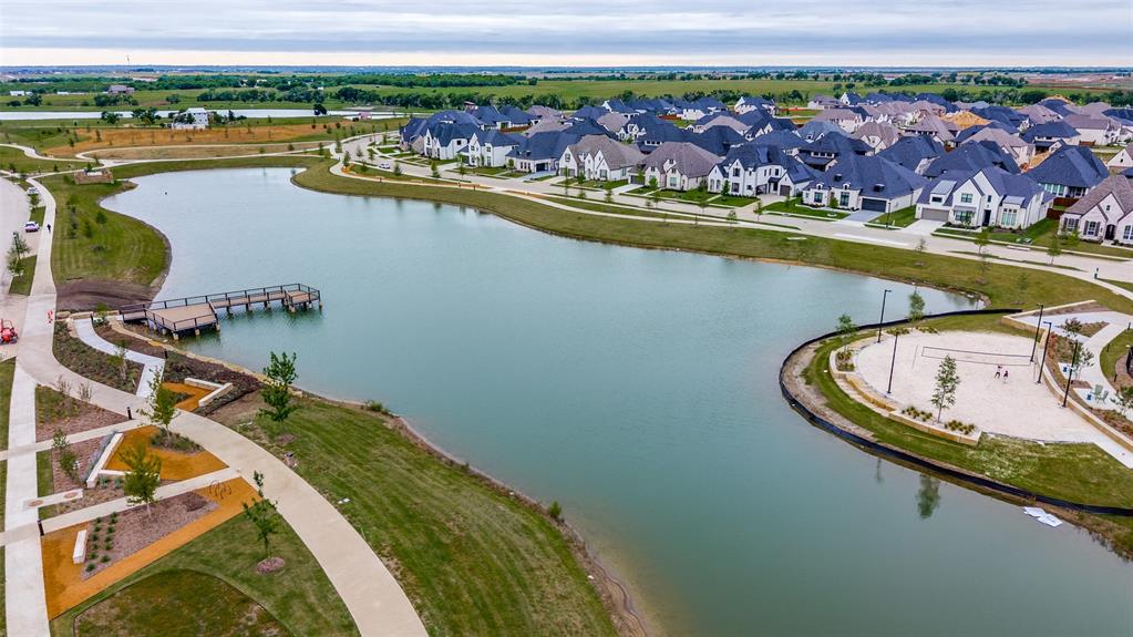 4400 Meander Way Prosper, TX 75078 - Photo 39 of 40 a view of a lake with a table and chairs