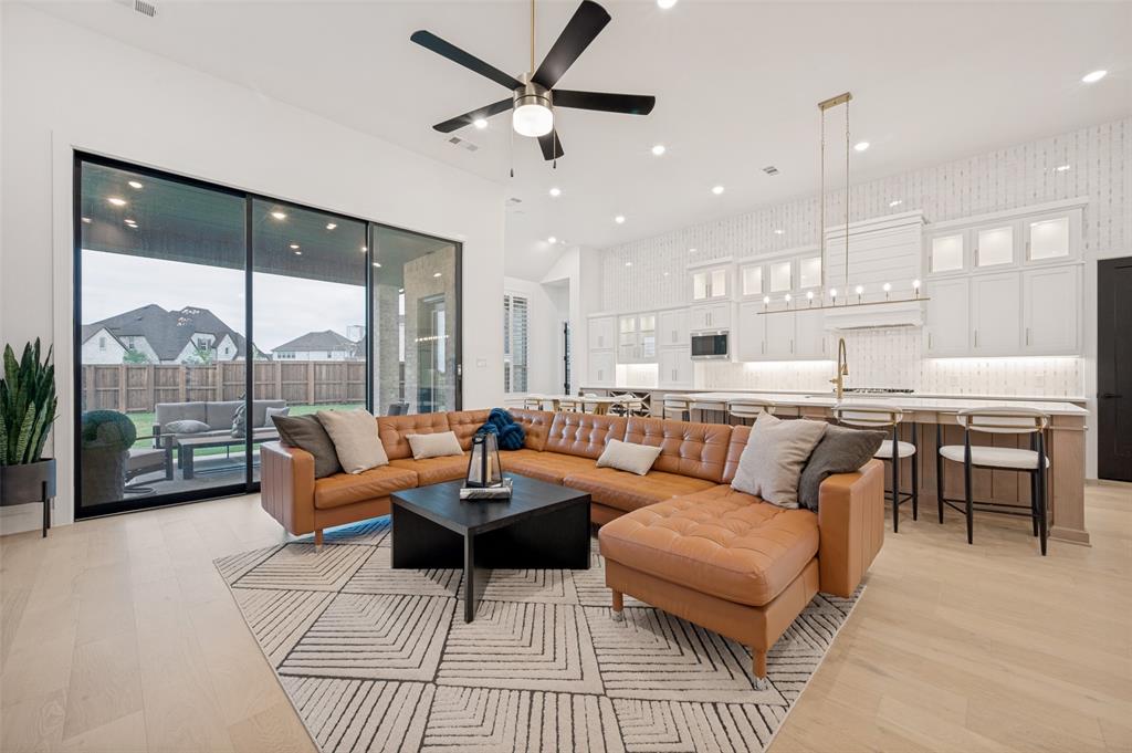 4400 Meander Way Prosper, TX 75078 - Photo 9 of 40 a living room with furniture and a large window