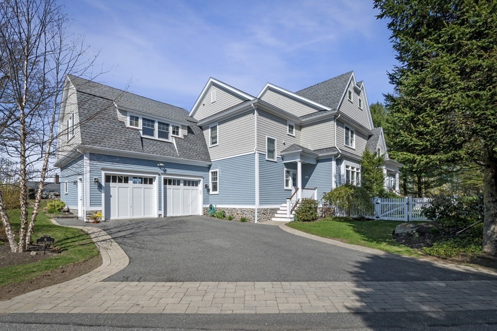 6 Captains Walk Lane Marblehead, MA 01945 - Photo 2 of 39 a front view of a house with garden