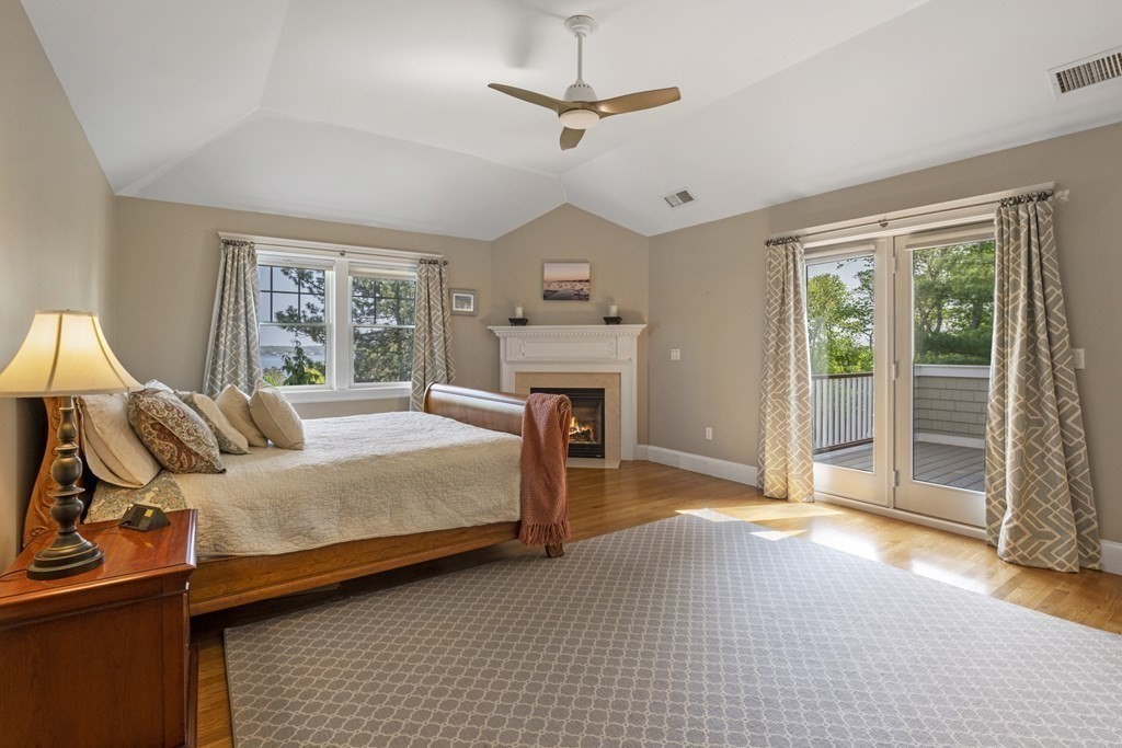 6 Captains Walk Lane Marblehead, MA 01945 - Photo 23 of 39 a bedroom with a bed and a fireplace
