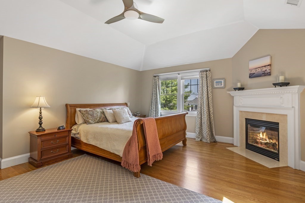 6 Captains Walk Lane Marblehead, MA 01945 - Photo 24 of 39 a bedroom with a bed and a fireplace