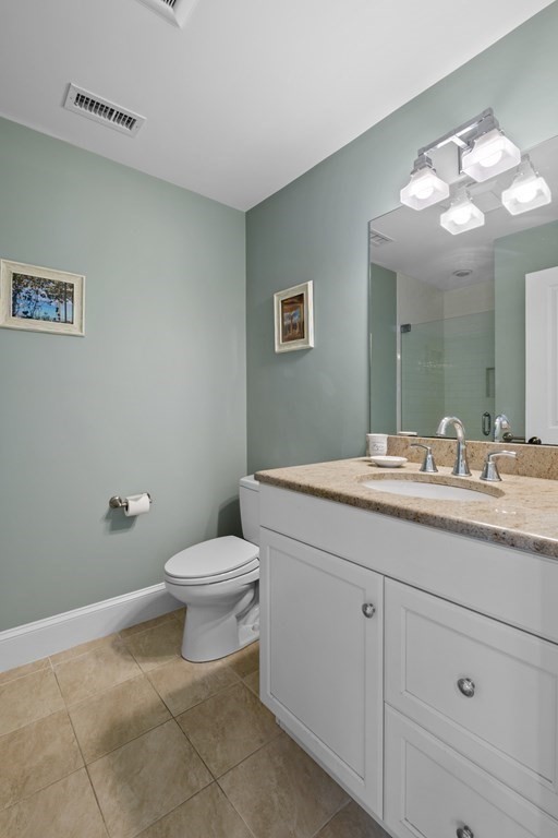 6 Captains Walk Lane Marblehead, MA 01945 - Photo 28 of 39 a bathroom with a toilet sink and mirror