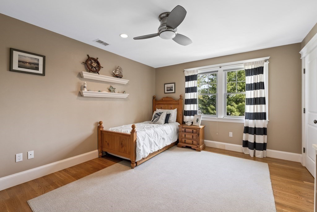 6 Captains Walk Lane Marblehead, MA 01945 - Photo 29 of 39 a bedroom with a bed and a large window