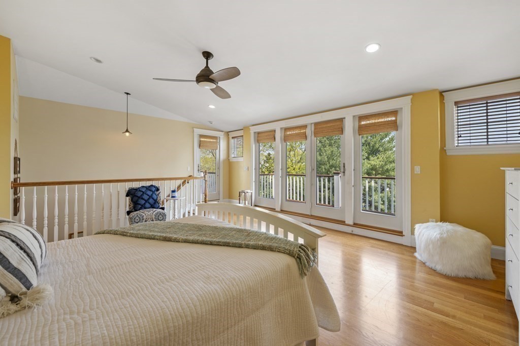 6 Captains Walk Lane Marblehead, MA 01945 - Photo 31 of 39 a spacious bedroom with a bed and glass walk in closet