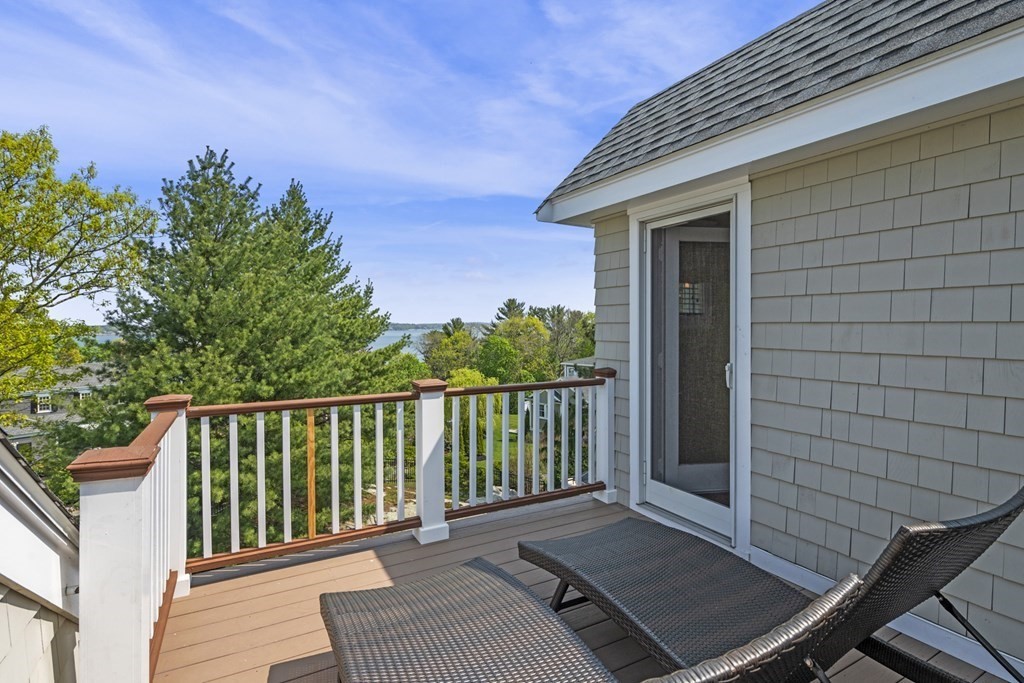 6 Captains Walk Lane Marblehead, MA 01945 - Photo 37 of 39 a view of a balcony with wooden floor and fence